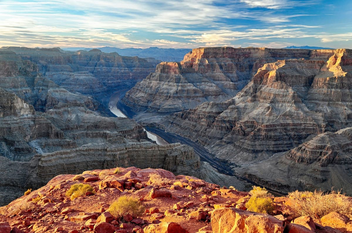 Panoramic view of the Grand Canyon showcasing its vastness and layered rock formations.